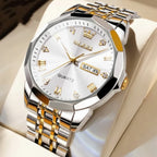 Silver and gold watch with a white face on a light background
